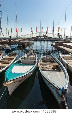 BARDOLINO, ITALY - MAY 4, 2016: Sailboats and fishing boats at Porto di Bardolino harbor on The Garda Lake . Italy
