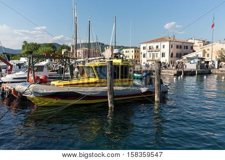 BARDOLINO, ITALY - MAY 4, 2016: Sailboats at Porto di Bardolino harbor on The Garda Lake . Italy