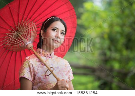 Portrait beautiful Chinese girl with dress traditional concept,copy space for text