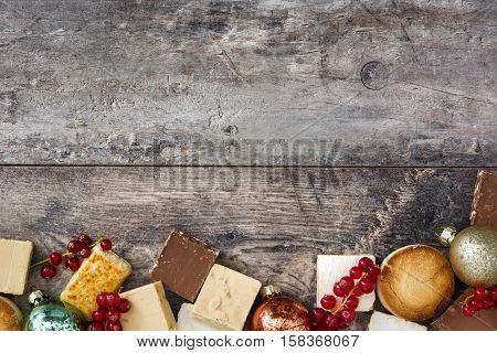 Christmas nougat and spanish polvorones on wooden background.Copyspace