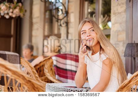 Young Woman In Caffee Looking Aside