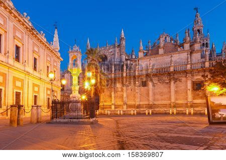 Plaza del Triunfo, Cathedral of Saint Mary and General Archive of the Indies in Seville at night, Andalusia, Spain