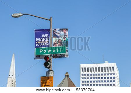 San Francisco, California, United States - August 17, 2016: close up of Powell street sign, the most famous and tourist tram line in San Francisco. On background, the Transamerica Pyramid.