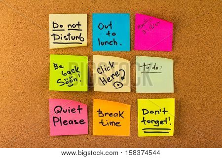 Nine Sticky Notes with the Passwords Written on Them as Reminders on Bulletin Board
