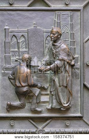 Prague, Czechia - November, 21, 2016: fragment of a door repousse of St. Vitus Cathedral in Prague Castle, Czechia