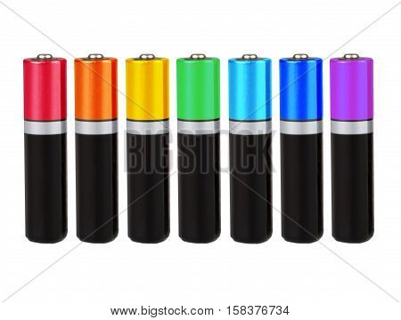 Seven batteries of the type AA in a row, seven colors of the rainbow (spectrum), on a white background, isolated