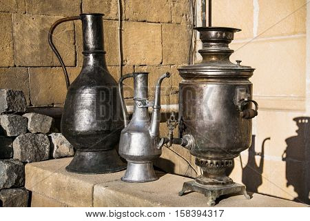 Old oriental antiques barass jungs and vases on street market in Baku, Azerbeijan.