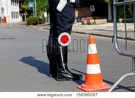 Policeman With Black Boots And Paddle Traffic