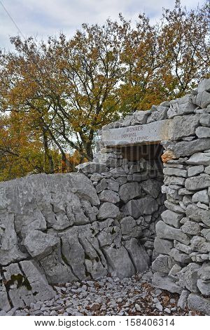 A World War One bunker in the Carso karst limestone area of Friuli Venezia Giulia near Aurisina Italy. The area was a major theatre of battle during the war and many remnants still remain today.