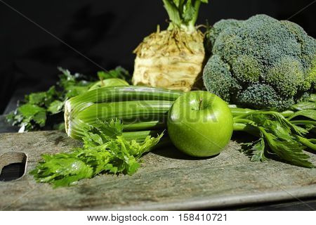 Green vegetables and fruits - celery apples celery root celeriac broccoli healthy diet concept