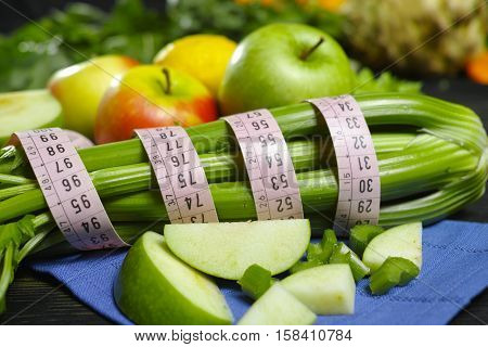 Green vegetables and fruits - celery shoots and apples healthy fitness diet concept