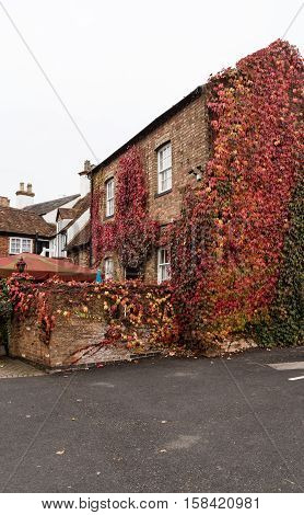 Winslow, Buckinghamshire, United Kingdom, October 25, 2016: The Bell Hotel With Red Creeping Ivy On