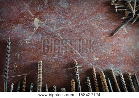 Texture grunge background screws lie on the table