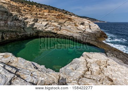 Green waters of Giola Natural Pool in Thassos island, East Macedonia and Thrace, Greece