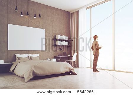 Side view of a young businessman in suit standing in his bedroom and holding a paper cup of coffee while enjoying the view. 3d rendering. Mock up. Toned image