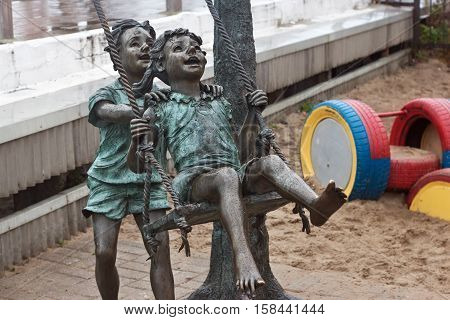 RUSSIA ZELENOGRADSK - OCTOBER 11 2014: Sculpture of children playing in the Zelenogradsk promenade. Zelenogradsk (Cranz) is a resort town in Kaliningrad Oblast Russia near the Curonian Spit on the Baltic Sea.