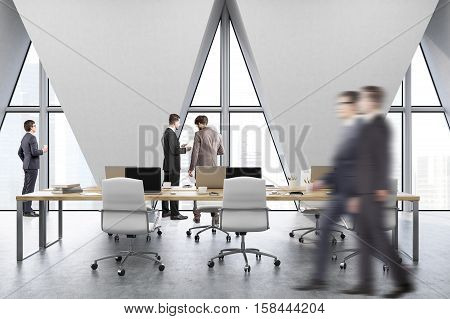 People in an open office with rost of tables with computers and three triangular windows. 3d rendering.