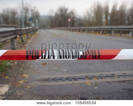 Local Police line (Polizia Municipale in Italian) do not cross. Bridge access blocked for flood risk