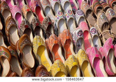 JAIPUR, INDIA - FEBRUARY 16: Display of traditional shoes at the street market in Jaipur. Jaipur is the capital and the biggest city of Rajasthan, India on February 16, 2016.