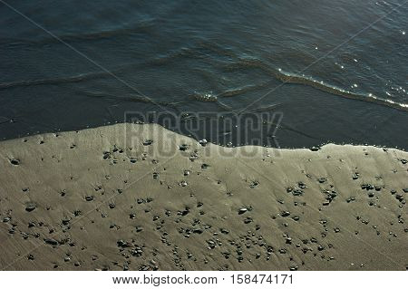 waves crashing on the sea beach rocks