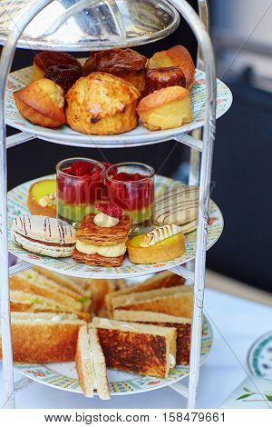 Selection Of Sandwiches And Fancy Cakes