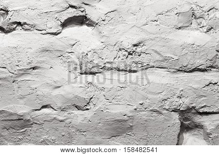 Brick wall background painted in grey color tone in grunge style