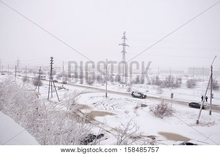 View from the window to the industial street in the winter frosty morning. North