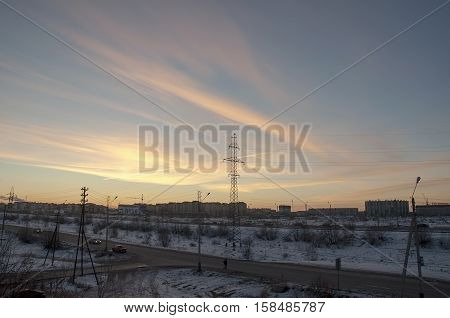 View from the window to the industial street in the winter frosty morning. North