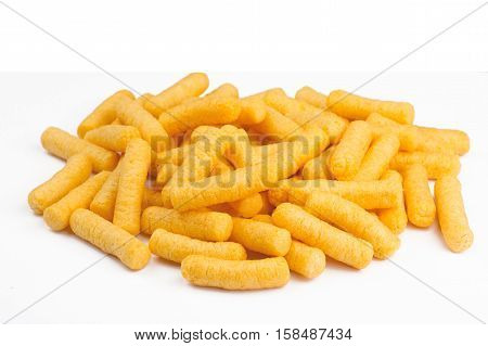 side view of many corn puff snacks isolated on white background