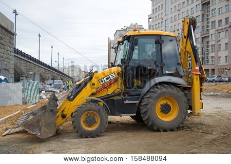 MOSCOW, RUSSIA - SEPTEMBER 07, 2016: The JCB-3CX excavator loader on reconstruction of an automobile outcome at Bolshoy Kamenny Bridge