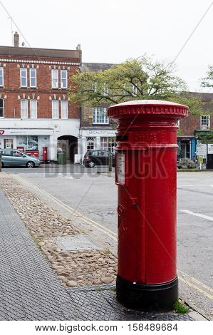 Winslow, Buckinghamshire, United Kingdom, October 25, 2016: Royal Mail Red Post Box On Market Square
