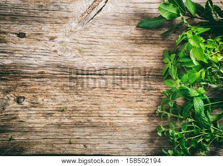 Variety Of Herbs On Wooden Background
