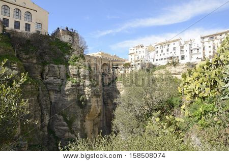The New Bridge And white houses over the gorge in Ronda Andalusia Spain