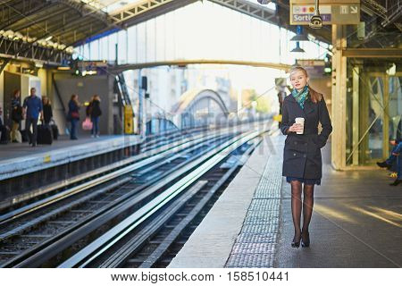 Beautiful Young Woman Waiting For A Train In Parisian Underground