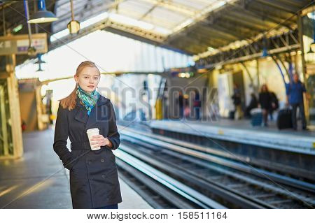 Beautiful Young Woman Waiting For A Train In Parisian Underground