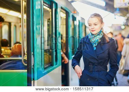 Woman Waiting For A Train On The Platform Of Parisian Underground