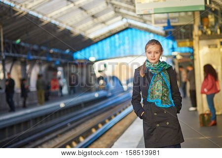 Young Woman Waiting For A Train On The Platform Of Parisian Underground