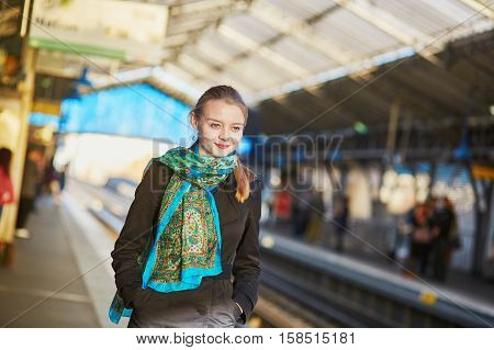Young Woman Waiting For A Train On The Platform Of Parisian Underground