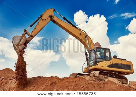Loader excavator at sandpit during earthmoving works