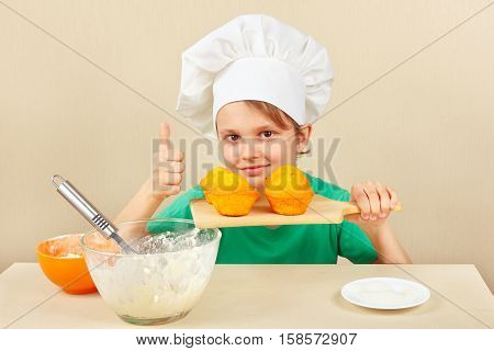 Little funny chef with a cooked the appetizing cake