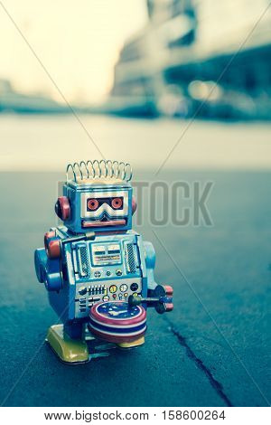 Old robot toy, vintage color style, vintage tone background.