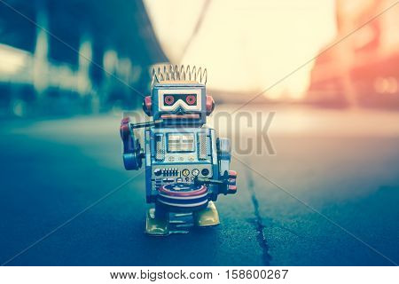 Old robot toy, vintage color style, vintage tone background.