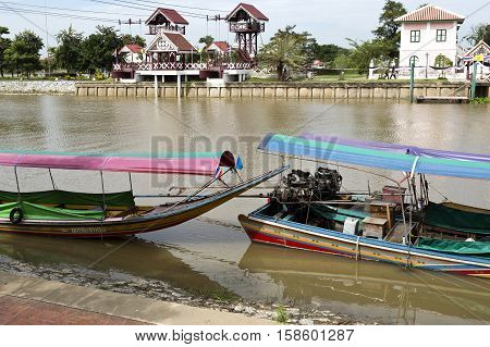 AYUTTHAYA, THAILAND - November 4, 2016: View of a long tail boat a type of watercraft native to Southeast Asia which uses a common automotive engine in the Chao Phraya River Thailand