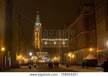 POLAND GDANSK - DECEMBER 30 2014: Nigh town on Long Market (Dlugi Targ) street before Christmas. Gdansk is a Polish city on the Baltic coast and popular center of tourism.