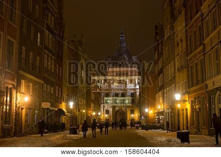 POLAND GDANSK - DECEMBER 30 2014: Nigh town on Long Market (Dlugi Targ) street before Christmas. Gdansk is a Polish city on the Baltic coast and popular center of tourism.