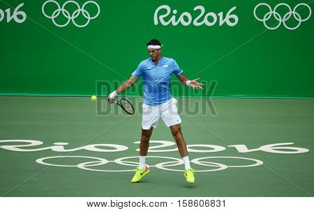 RIO DE JANEIRO, BRAZIL - AUGUST 11, 2016: Grand Slam champion Juan Martin Del Potro of Argentina in action during his quarterfinal match of the Rio 2016 Olympic Games at the Olympic Tennis Centre