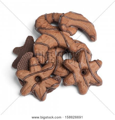 Heap of chocolate cookies in different shape isolated on white background