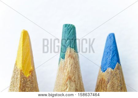 Colored pencils sharpened by hand closeup. Selective focus