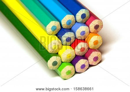 a stack of colored pencils on a white background isolated