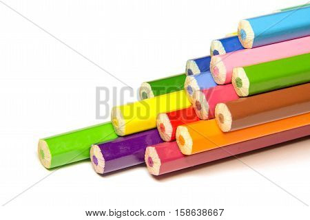 a stack of colored pencils on a white background isolated